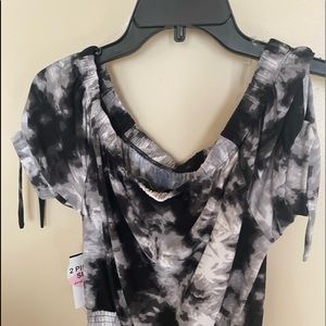 Very cute  2 Piece outfit. Black and white.  Never worn with tags